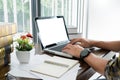 young caucasian man working at home planning work writing note on some project with his laptop on a desk, strartup business, e Royalty Free Stock Photo