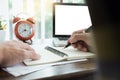 young caucasian man working at home planning work writing note on some project with his laptop on a desk, strartup business, e Royalty Free Stock Photo