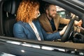 Young caucasian married couple inside of new car