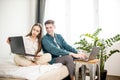 Married couple looking for a bargain online Royalty Free Stock Photo