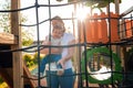 A young caucasian mother plays with a baby on the playground. Sunset in the background. Summertime Royalty Free Stock Photo