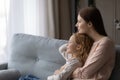 Caring young mom and little daughter dream at home Royalty Free Stock Photo