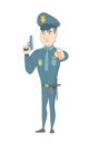 Young caucasian policeman holding a handgun.
