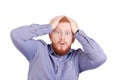 Young caucasian redhead young man with beard isolated on white background receiving surprise, excited and shocked with Royalty Free Stock Photo