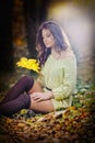 Young Caucasian sensual woman in a romantic autumn scenery. Fall lady .Fashion portrait of a beautiful young woman in forest Royalty Free Stock Photo