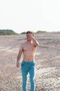 Shirtless on a beach