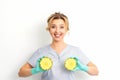 Young Caucasian smiling woman doctor nutritionist holding slices pineapple over isolated white background, breast health Royalty Free Stock Photo