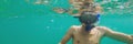 A young caucasian snorkeling man under water selfie Thailand BANNER, long format Royalty Free Stock Photo