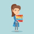 Young caucasian student holding pile of books. Royalty Free Stock Photo