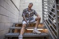 Young caucasian tattooed singer rap posing