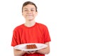 Young caucasian teenage boy with a bar of chocolate Royalty Free Stock Photo