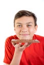 Young caucasian teenage boy with a bar of chocolate Royalty Free Stock Photo