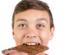 Young caucasian teenage boy with a bar of chocolate Royalty Free Stock Photo