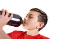 Young caucasian teenage boy drinking cola Royalty Free Stock Photo