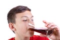 Young caucasian teenage boy drinking cola Royalty Free Stock Photo