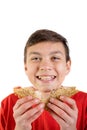 Young caucasian teenage boy with a sandwich Royalty Free Stock Photo