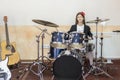 young caucasian teenage girl plays the drums. girl playing the drum set Royalty Free Stock Photo