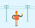 Electrician repairing an electric power pole.