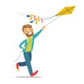 Young caucasian white man flying a kite. Royalty Free Stock Photo