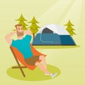 Man sitting in a folding chair in the camping.