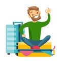 Young caucasian white man sitting on suitcase. Royalty Free Stock Photo