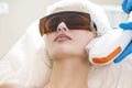 Young Caucasian Winsome Woman Getting IPL Laser and Ultrasound Facial Treatment in Modern Medical Spa Center As Skin Rejuvenation Royalty Free Stock Photo