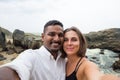 Young caucasian woman and asian man making selfie during honey moon in Sri lanka on beach Royalty Free Stock Photo