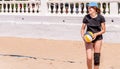 Young caucasian woman in bikini playing beach volleyball Royalty Free Stock Photo