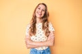 Young caucasian woman with blond hair wearing casual summer clothes happy face smiling with crossed arms looking at the camera Royalty Free Stock Photo