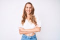 Young caucasian woman with blond hair wearing casual summer clothes happy face smiling with crossed arms looking at the camera Royalty Free Stock Photo