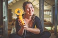 Woman holding a yellow angle grinder