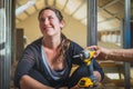 Woman holding a yellow angle grinder