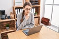 Young caucasian woman business worker using laptop suffering for throat pain at office Royalty Free Stock Photo