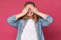 Young caucasian woman covering her eyes with palms waiting for surprise Royalty Free Stock Photo