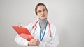 Young caucasian woman doctor reading document on clipboard over isolated white background Royalty Free Stock Photo