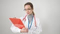 Young caucasian woman doctor reading document on clipboard over isolated white background Royalty Free Stock Photo