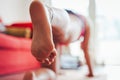 Young caucasian woman doing yoga at home