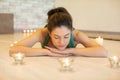 young caucasian woman doing yoga on sofa at home