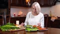 Young Caucasian woman eating salad, feeling nausea, and running away. Portrait of beautiful blond lady vomitting at