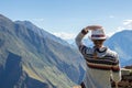 Young free woman travel alone in Andes mountains in Peru. Landscape with solo female tourist, mountains and copy space Royalty Free Stock Photo