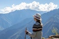 Young free woman travel alone in Andes mountains in Peru. Landscape with solo female tourist, mountains and copy space Royalty Free Stock Photo