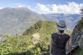 Young free woman travel alone in Andes mountains in Peru. Landscape with solo female tourist, mountains and copy space Royalty Free Stock Photo