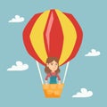 Young caucasian woman flying in hot air balloon.