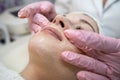 young caucasian woman getting facial spa massage at spa salon Royalty Free Stock Photo