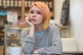 Young Caucasian woman girl in casual clothes sweater sitting at