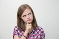 Young caucasian woman girl with questioning, puzzled, confused expression, thinking or remembering something Royalty Free Stock Photo