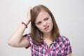 Young caucasian woman girl with questioning, puzzled, confused expression, thinking or remembering something Royalty Free Stock Photo