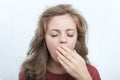 Young caucasian woman girl, yawning, tired or sleepy, disheveled hair