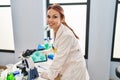 Young caucasian woman gynecologist looking embryo on touchpad at laboratory