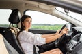 young caucasian woman hold steering wheel and driving car Royalty Free Stock Photo